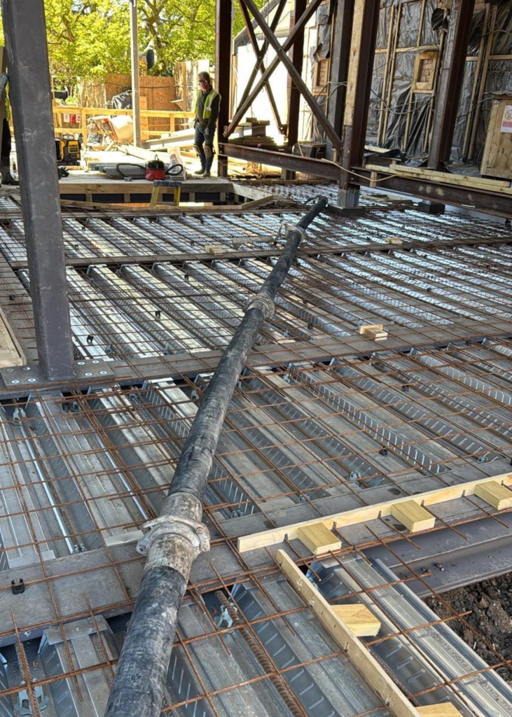 A King Concrete Pumping line pump feeding concrete on site near Worthing
